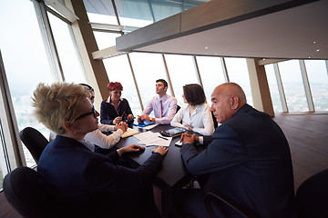 Image showing business people group on meeting at modern bright office