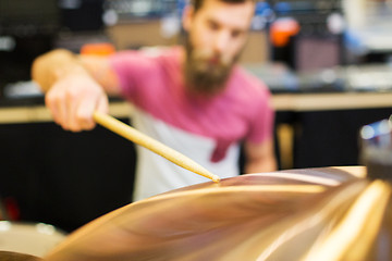 Image showing close up of male musician playing cymbals