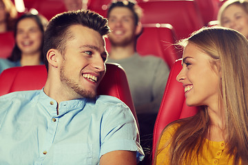 Image showing happy friends watching movie in theater