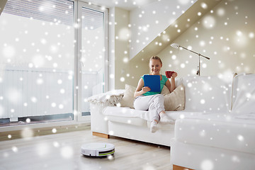 Image showing happy woman with tablet pc drinking tea at home