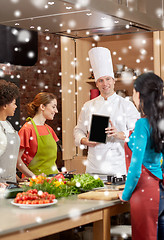 Image showing happy women with chef and tablet pc in kitchen