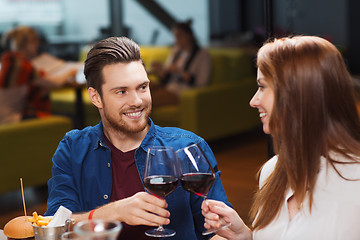 Image showing couple dining and drinking wine at restaurant