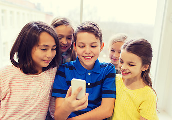 Image showing group of school kids taking selfie with smartphone