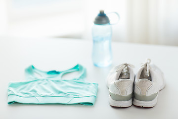 Image showing close up of female sports clothing and bottle set