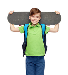 Image showing happy student boy with backpack and skateboard