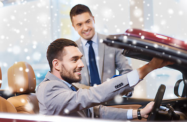 Image showing happy man with car dealer in auto show or salon