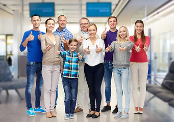 Image showing group of smiling people showing thumbs up