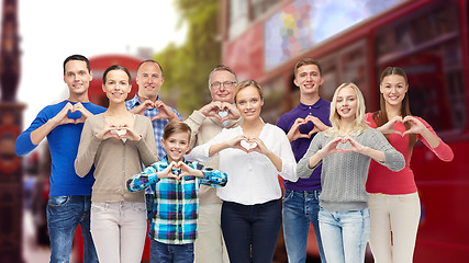 Image showing people showing heart hand sign over london city