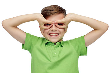 Image showing happy boy in t-shirt having fun and making faces