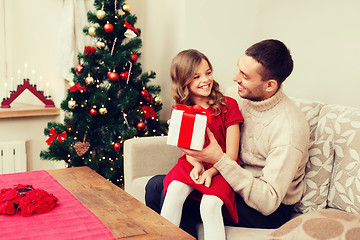 Image showing smiling father and daughter looking at each other