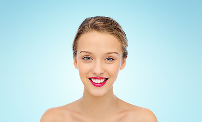 Image showing smiling young woman face and shoulders