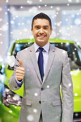 Image showing man showing thumbs up at auto show or car salon