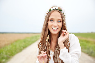 Image showing smiling young hippie woman on cereal field