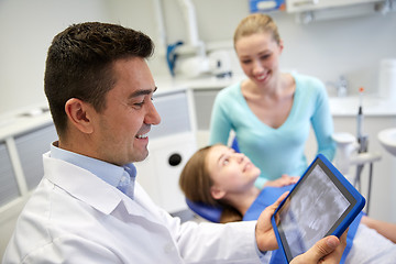 Image showing dentist with x-ray on tablet pc and patient girl