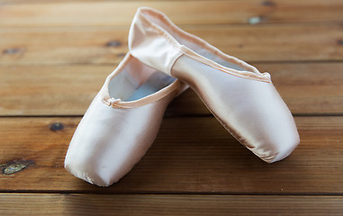 Image showing close up of pointe shoes on wooden floor