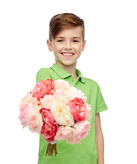 Image showing happy boy holding flower bunch