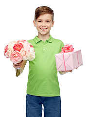 Image showing happy boy holding flower bunch and gift box