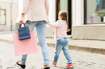Image showing close up of mother and child shopping in city