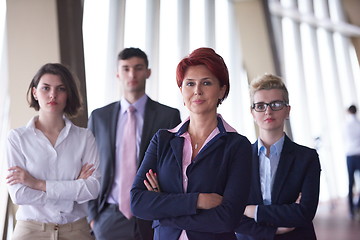 Image showing diverse business people group with redhair  woman in front