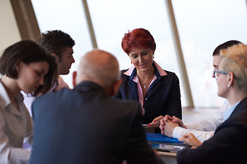 Image showing business people group on meeting at modern bright office