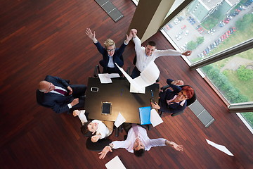 Image showing top view of business people group throwing dociments in air