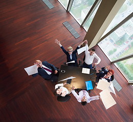 Image showing top view of business people group throwing dociments in air