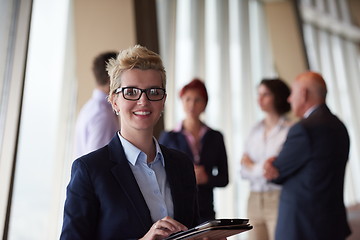 Image showing diverse business people group with blonde  woman in front