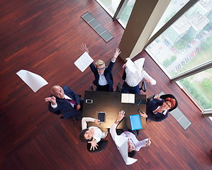 Image showing top view of business people group throwing dociments in air