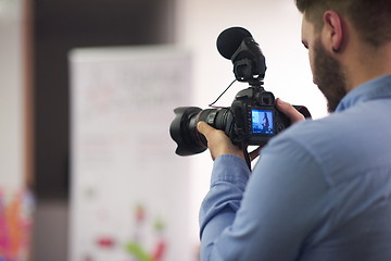 Image showing videographer recording on conference