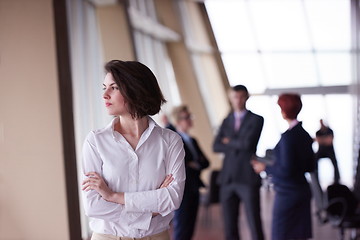 Image showing business people group, woman in front  as team leader