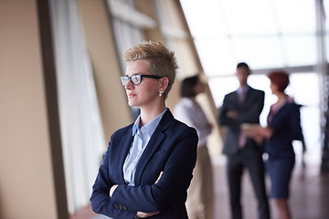 Image showing business people group, woman in front  as team leader