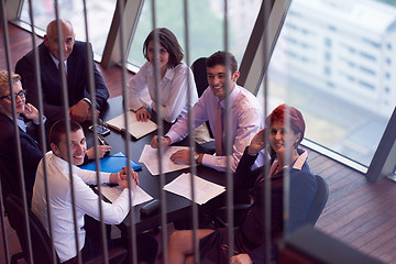 Image showing business people group on meeting at modern bright office