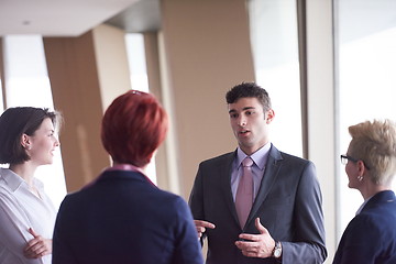 Image showing business people group on meeting at modern bright office