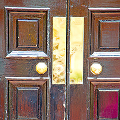 Image showing brown wooden parliament in london old  door and marble antique  