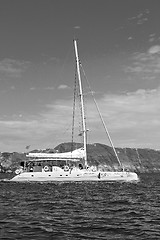 Image showing from one  boat in europe greece santorini island house and rocks