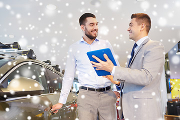 Image showing happy man with car dealer in auto show or salon