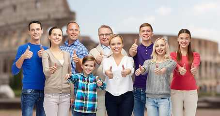 Image showing happy people showing thumbs up over coliseum