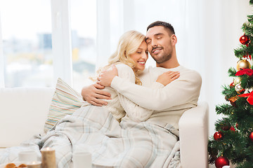 Image showing happy couple at home with christmas tree