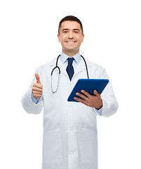 Image showing smiling male doctor in white coat with tablet pc