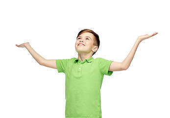 Image showing happy boy in polo t-shirt raising hands up