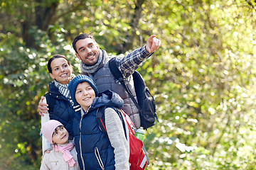 Image showing happy family with backpacks hiking