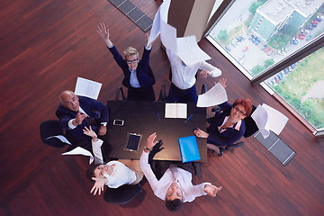 Image showing top view of business people group throwing dociments in air