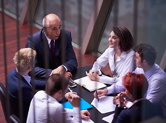 Image showing business people group on meeting at modern bright office