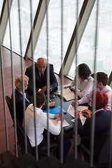 Image showing business people group on meeting at modern bright office