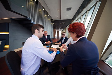 Image showing business people group on meeting at modern bright office