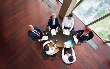 Image showing top view of business people group throwing dociments in air