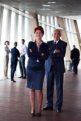 Image showing diverse business people group with redhair  woman in front