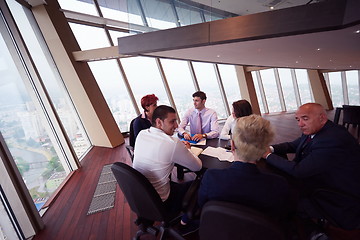 Image showing business people group on meeting at modern bright office