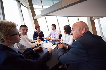 Image showing business people group on meeting at modern bright office