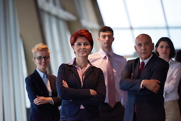 Image showing diverse business people group with redhair  woman in front